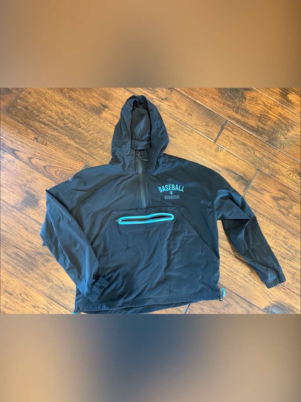 Youth Black Hooded Rain Pullover with Teal Zip Pocket